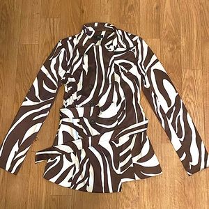 Zebra print coat in good condition. Made of polyester, cotton, and spandex.